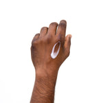 PRIORI DNA Recovery Face Serum Product consistency shown on model's hand