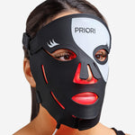 PRIORI Unveiled Red Light LED Face Mask in Black and White closeup on model.