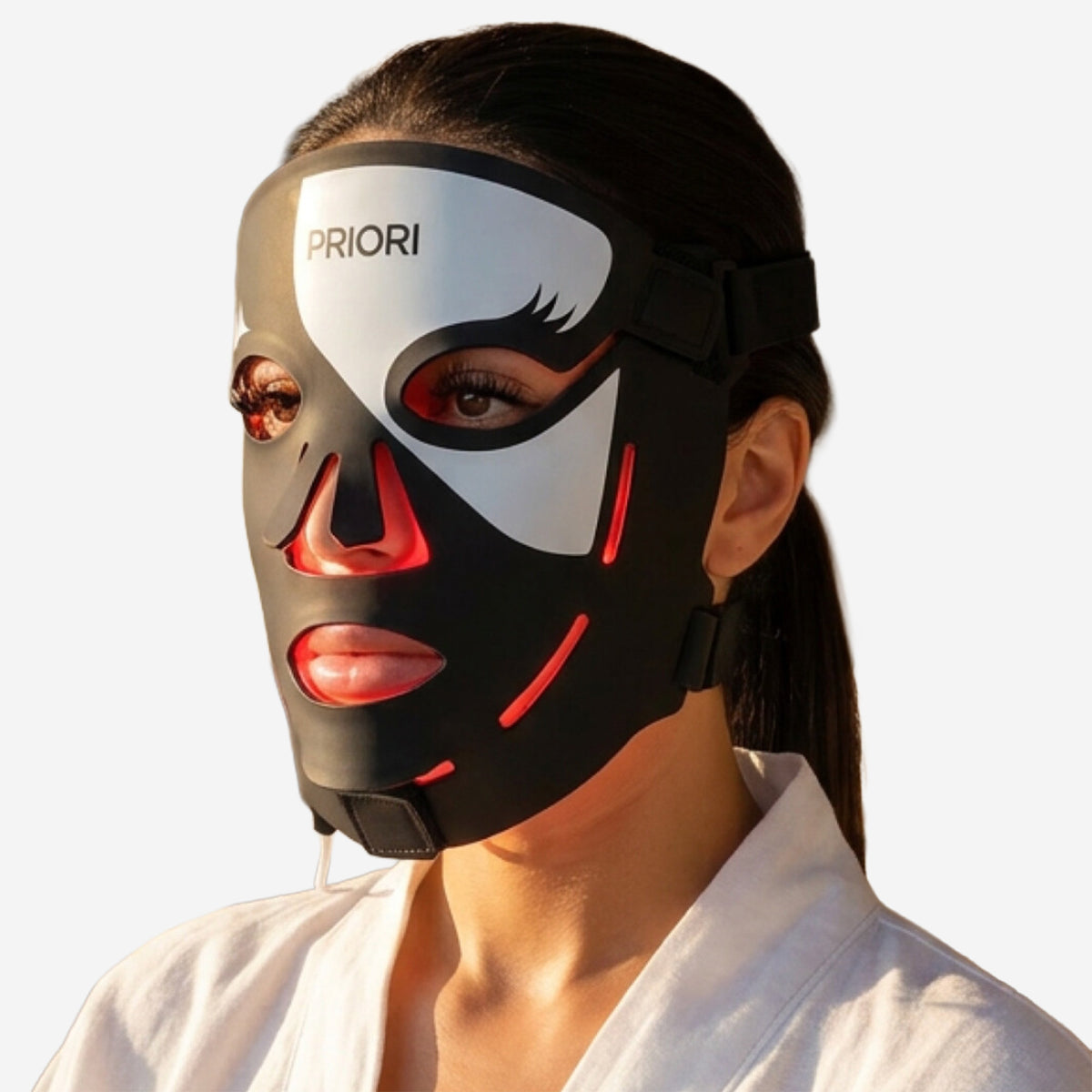 PRIORI Face Red Light Therapy Mask in Black and White FDA Cleared Anti-aging closeup on model.