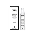 PRIORI Tetra Tinted Day Shield SPF 55 Broad Spectrum mineral sunscreen shown as a white pump bottle next to its black and white retail box on a plain white background.