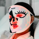 PRIORI Unveiled Red Light LED Face Mask with Blue Accents - In use on model
