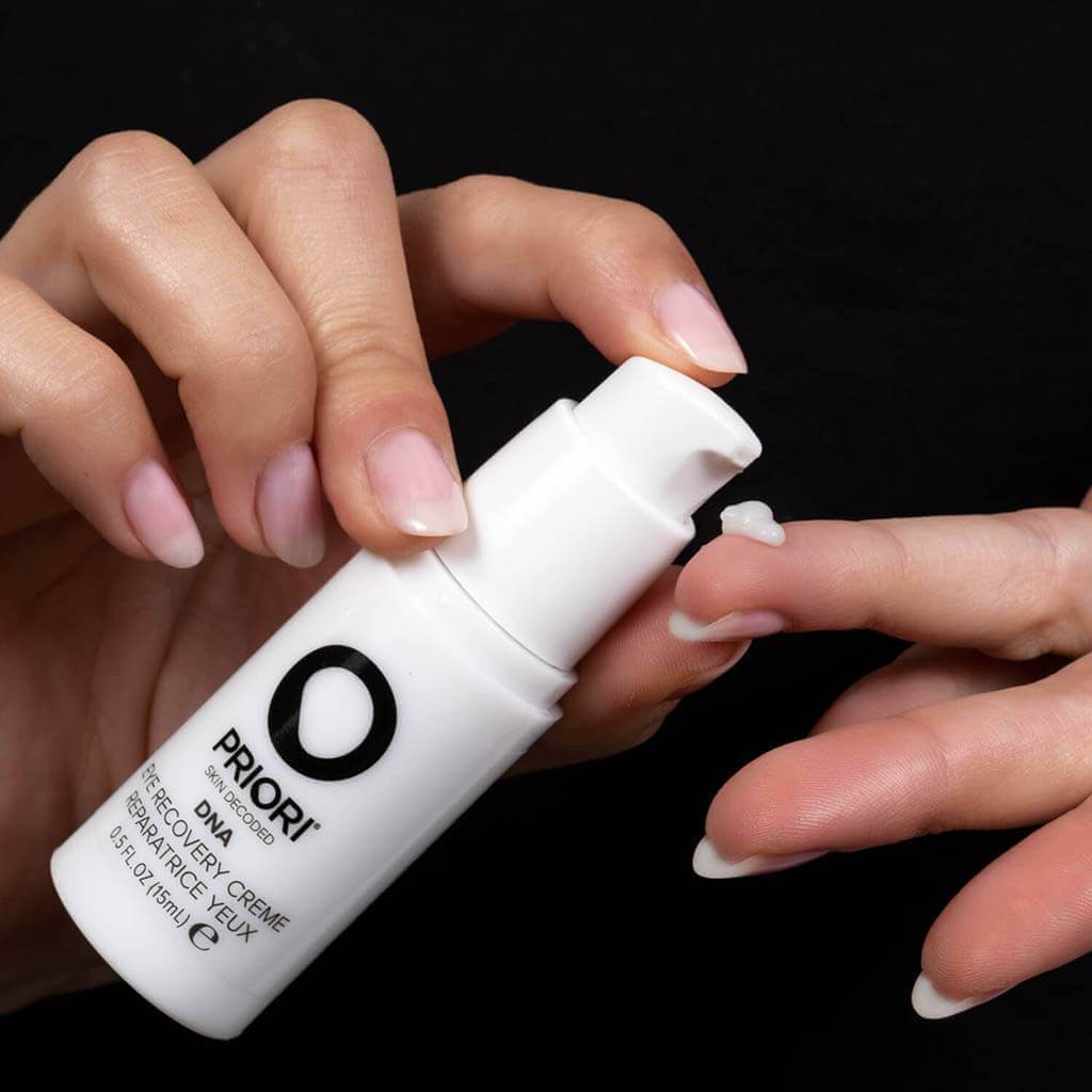 PRIORI DNA Eye Recovery Cream Consistency shown on model finger